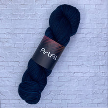 Load image into Gallery viewer, Dark blue skein of yarn with a label on a textured white background
