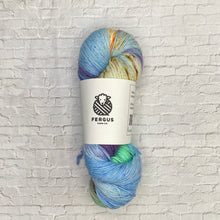Load image into Gallery viewer, Multicolored skein of yarn with a Fergus Yarn Co. label on a white brick background
