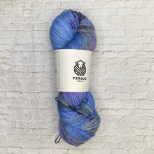 Load image into Gallery viewer, Blue skein of yarn with a Fergus label on a textured white background
