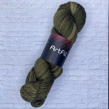 Load image into Gallery viewer, Olive green skein of yarn with a label on a textured white background
