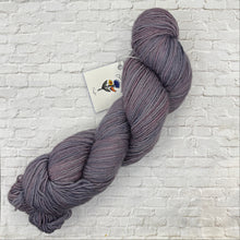 Load image into Gallery viewer, Purple skein of yarn with a tag on a textured white background
