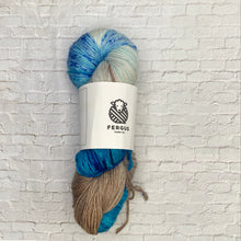 Load image into Gallery viewer, Yarn skein with Fergus Yarn Co. label on a white brick background
