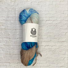 Load image into Gallery viewer, Yarn skein with Fergus Yarn Co. label on a white brick background
