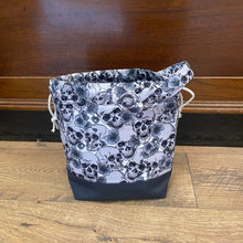 Load image into Gallery viewer, Black and white floral lace dress on a hanger against a wooden door.
