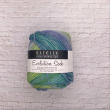 Load image into Gallery viewer, Ball of yarn with Estelle label on a white brick background
