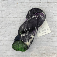 Load image into Gallery viewer, Multicolored skein of yarn with a 'Matchbox Yarn' label on a white brick background
